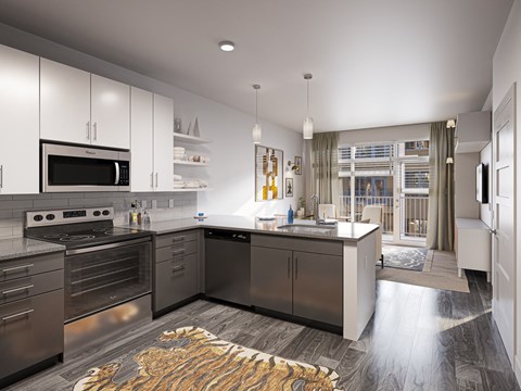 a kitchen with stainless steel appliances and a counter top at Link Apartments® Broad Ave, Memphis, 38112